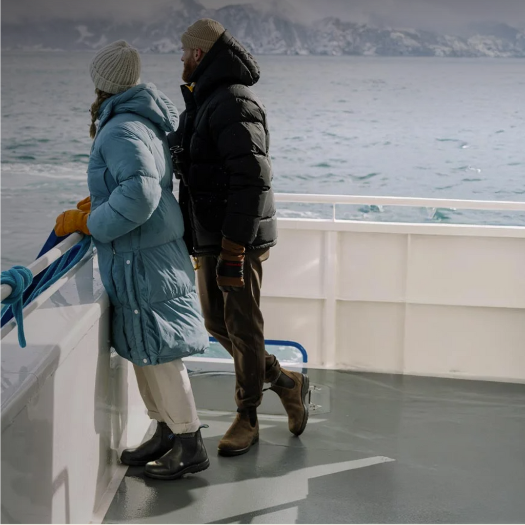 Couple wearing Blundstones on a boat